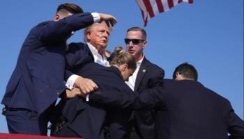 Donald Trump is rushed off stage at a rally in Pennsylvania after gunshots were fired, July 13, 2024 (Xinhua/Shutterstock)