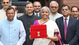 Finance Minister Nirmala Sitharaman holding a folder containing documents pertaining to the budget for the fiscal year ending March 2025 (Arvind Yadav/Hindustan Times/Shutterstock)

