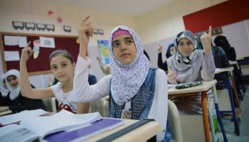 Syrian refugees studying in a camp in Turkey (Shutterstock/ehasdemir)