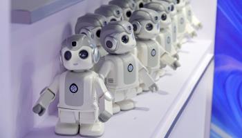 Humanoid robots at a show (Costfoto/NurPhoto/Shutterstock)