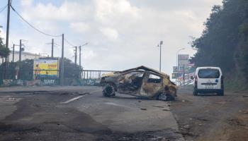 A burnt car in France’s overseas territory of New Caledonia (Chabaud Gill/ABACA/Shutterstock)