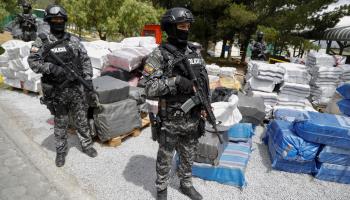 Police guard bags of cocaine awaiting destruction in Quito. June 2023 (Santiago Fernandez/EPA-EFE/Shutterstock)