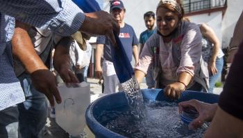 People collect water in the municipality of Guadalupe, state of Nuevo Leon, Mexico, 08 July 2022 (issued 14 July 2022). Former head of the People collect water in Guadalupe, Nuevo Leon (Miguel Sierra/EPA-EFE/Shutterstock)