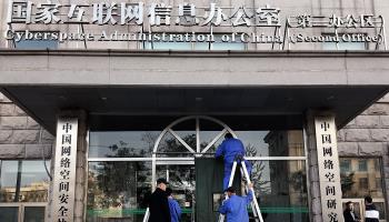 Workers clean the exterior of the Cyberspace Administration of China’s second office in Beijing (Stephen Shaver/UPI/Shutterstock)