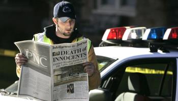 A man reads a local newspaper in Lancaster, Pennsylvania, in 2007; the paper merged with another in 2009 (Matthew Cavanaugh/EPA/Shutterstock)