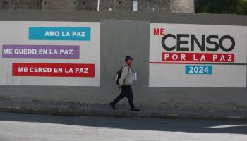 A volunteer walks down a street during the population and housing census, in La Paz (Luis Gandarillas/EPA-EFE/Shutterstock)