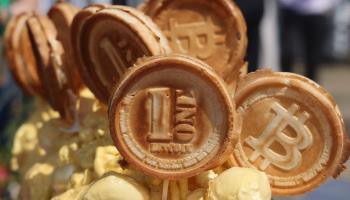 Waffles decorated with imprints of various cryptocurrency logos seen at a Korean food festival in Toronto (Creative Touch Imaging Ltd/NurPhoto/Shutterstock)