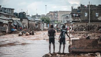 Children watch as flood waters run through Nairobi's Mathare slum, Kenya, April 30, 2024 (Xinhua/Shutterstock)