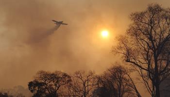 Firefighters dropping water on a forest fire in Parana state (Rafaela Fernanda05/Shutterstock)

