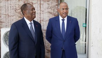 Ivorian President Alassane Ouatarra (L) with former Prime Minister Patrick Achi (R), April 2021  (Legnan Koula/EPA-EFE/Shutterstock)