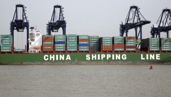 Cranes unloading containers China Shipping Line container ship, Port of Felixstowe, Suffolk, England (Ian Murray/imageBROKER/Shutterstock)