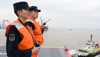 A tugboat tows the Fujian, China’s third aircraft carrier, away from a dock in Shanghai as it departs for its maiden sea trials (Xinhua/Shutterstock)