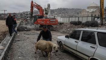 An excavator demolishing a damaged building in Kahramanmaras, February 2024 (Erdem Sahin/EPA-EFE/Shutterstock)