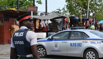 Police patrolling a street in Kingston (Angela Weiss/AFP Via Getty Images)