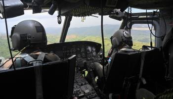 A Honduran Air Force jet overflying a coca plantation (Orlando Sierra/AFP via GettyImages)