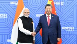 Indian Prime Minister Narendra Modi (left) meeting Chinese President Xi Jinping (right) on the sidelines of the BRICS summit in Kazan, Russia, on October 23 (Xinhua/Shutterstock)

