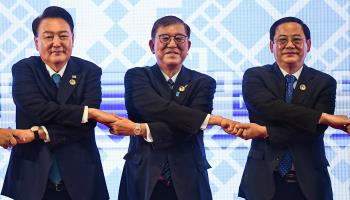 South Korean President Yoon Suk-yeol (left) and Japanese Prime Minister Shigeru Ishiba (centre) at the ASEAN Plus Three summit (Nhac Nguyen/AFP/Getty Images)