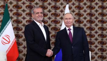 Iranian President Masoud Pezeshkian with Russian President Vladimir Putin, Ashgabat, October 11, 2024 (Alexander Shcherbak/AFP/Getty Images)

