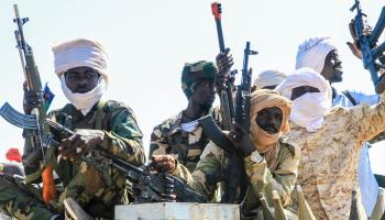 SAF-aligned Darfuri militia fighters attend a military graduation ceremony in Gedaref State, March 28, 2024 (AFP/Getty Images)