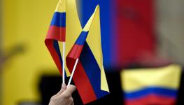 Supporters of President Gustavo Petro hold Colombian flags at a rally in Bogota (Guillermo Legaria Schweizer/Getty Images)
