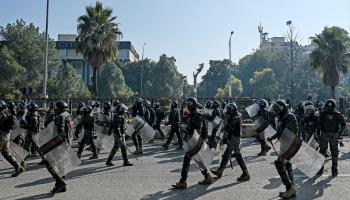 Paramilitary soldiers marching along a street in Islamabad yesterday as supporters of the opposition Pakistan Tehreek-e-Insaf party gathered in the capital to protest (Aamir Qureshi/AFP/Getty Images)

