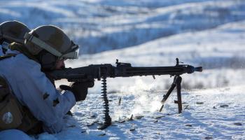 A Norwegian army soldier fires an automatic weapon (Robert Nickelsberg/Getty Images)