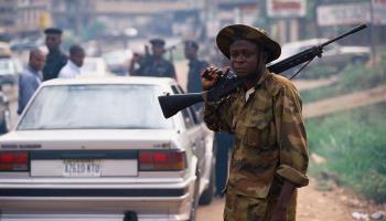 A soldier standing at a Lagos roadblock, 2016 (James Marshall/The Image Bank Unreleased/Getty Images)