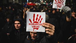 Protesters holding placards reading “corruption kills” in Belgrade, November 2024 (Andrej Isakovic/AFP/Getty Images)