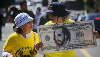 Activists in San Salvador protest against budget cuts (Aphotografia/Getty Images)