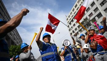 Informal miners protesting outside the Peruvian Congress (Ernesto Benavides/AFP via Getty Images)