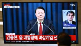 President Yoon Suk-yeol declaring martial law in a televised national address (Anthony Wallace/AFP/Getty Images)
