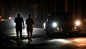 Locals walk through Havana during a nationwide blackout (Yamil Lage/AFP/Getty Images)