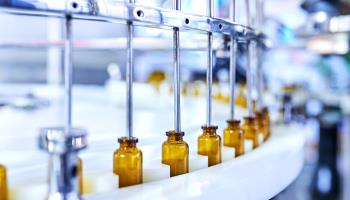 Brown glass medicine bottles on production line (Comezora/Moment RF/Getty Images)