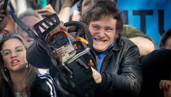 President Javier Milei campaigning with his trademark chainsaw (Tomas Cuesta/Getty Images)