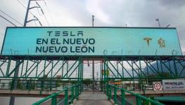 A billboard announcing the arrival of US electric car maker Tesla in Nuevo Leon, Mexico (Julio Cesar Aguilar/AFP/Getty Images)