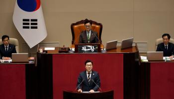 Floor leader of the Democratic Party of Korea Park Chan-dae speaks during the plenary session for the impeachment vote (Woohae Cho/Getty Images)

