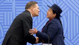 Rosatom Alexei Likhachev (L) greets Bolivian Foreign Minister Celinda Sosa Lunda in Kazan, 2024 (Maxim Shemetov/POOL/AFP/Getty Images)