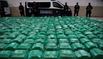 Spanish police and customs officers guard packages of cocaine found in a shipment of bananas from Ecuador (Jorge Guerrero/AFP via Getty Images)