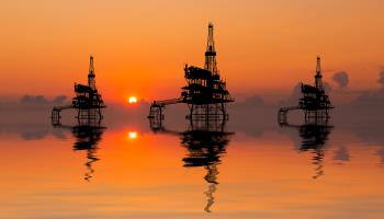 Offshore oil rigs at sunset (Anton Petrus/Moment RF/Getty Images)