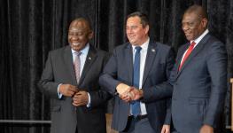 DA leader John Steenhuisen (centre) poses with President Cyril Ramaphosa (left) and Deputy President Paul Mashatile (right) following the GNU’s establishment, July 3, 2024 (Rodger Bosch/AFP/Getty Images)

