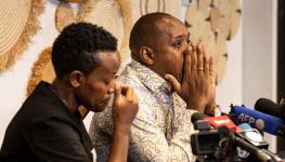 Boniface Mwangi and Agather Atuhaire relate their experience at the hands of Tanzanian security forces (Tony Karumba/AFP/Getty Images)

